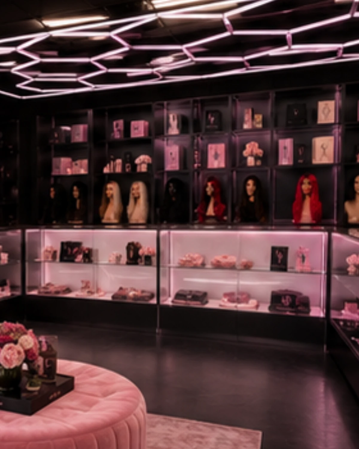 The Lace Factory Miami showroom floor — units on the wall, backlit cases, the seating corner